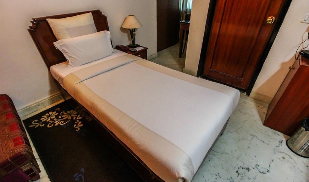 Hotel Pigeon International Bangalore Værelse billede