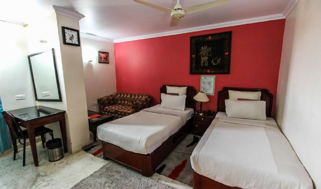 Hotel Pigeon International Bangalore Værelse billede